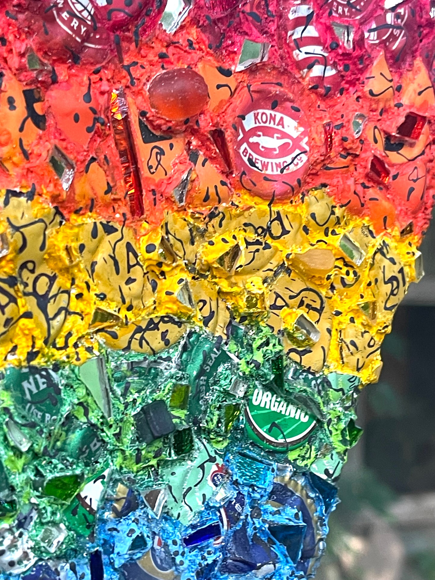 Rainbow pride bottle cap triangle with mirror bits. Glorious!