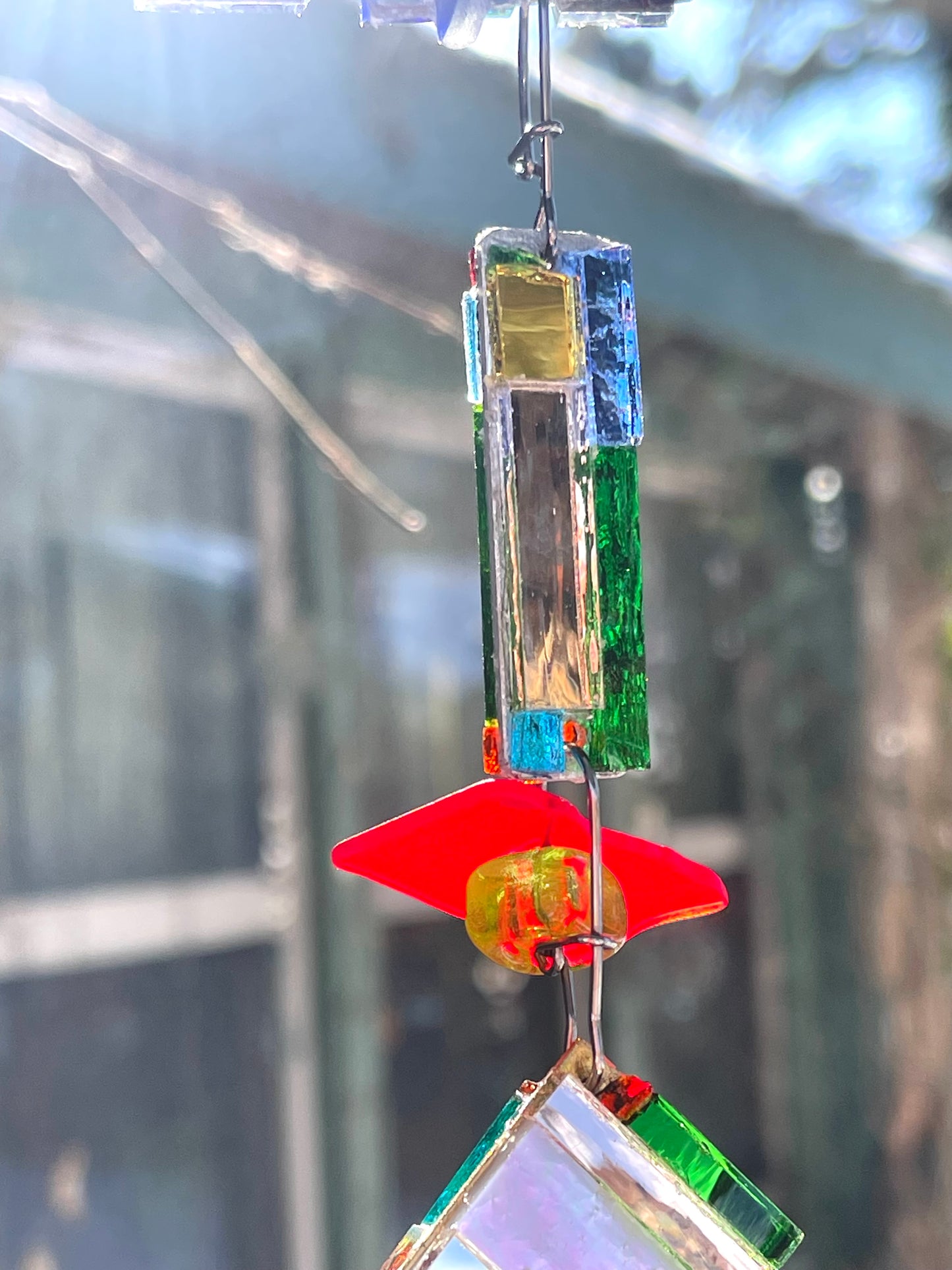 Long 48" mirror mosaic sun chain lots of blue, glowing amber, juicy reds