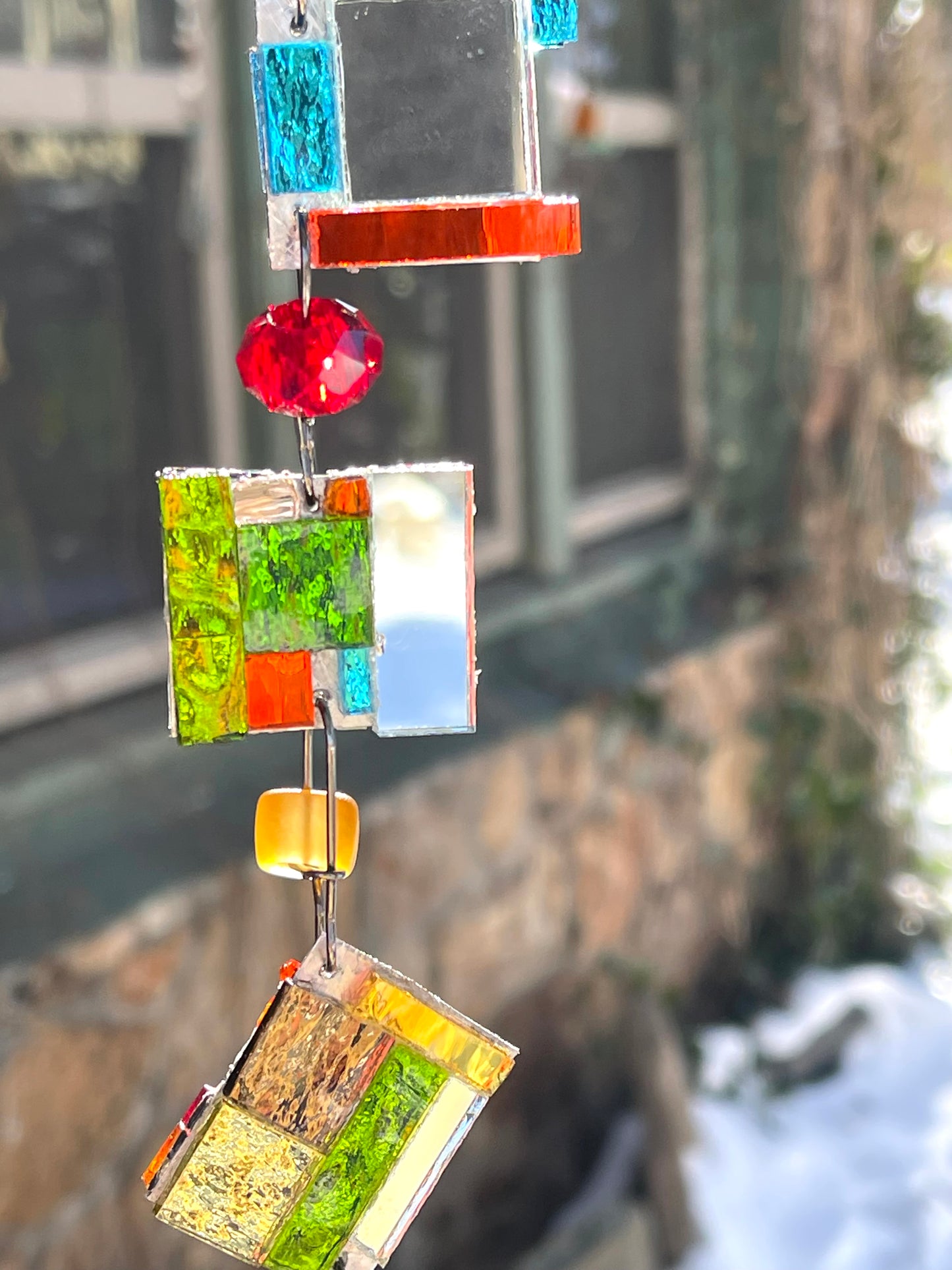 Long 48" mirror mosaic sun chain lots of blue, glowing amber, juicy reds