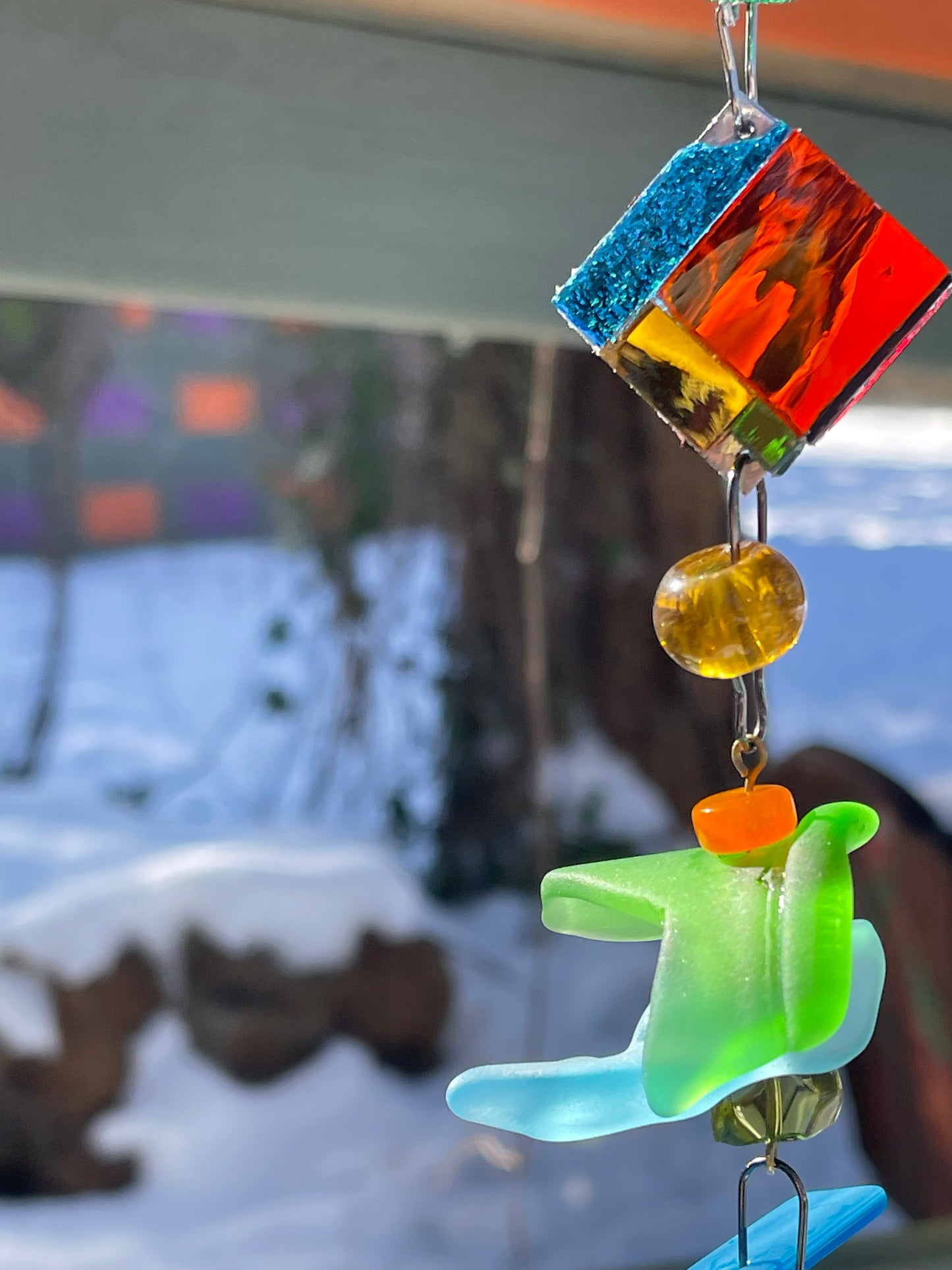 Long 48" mirror mosaic sun chain lots of blue, glowing amber, juicy reds