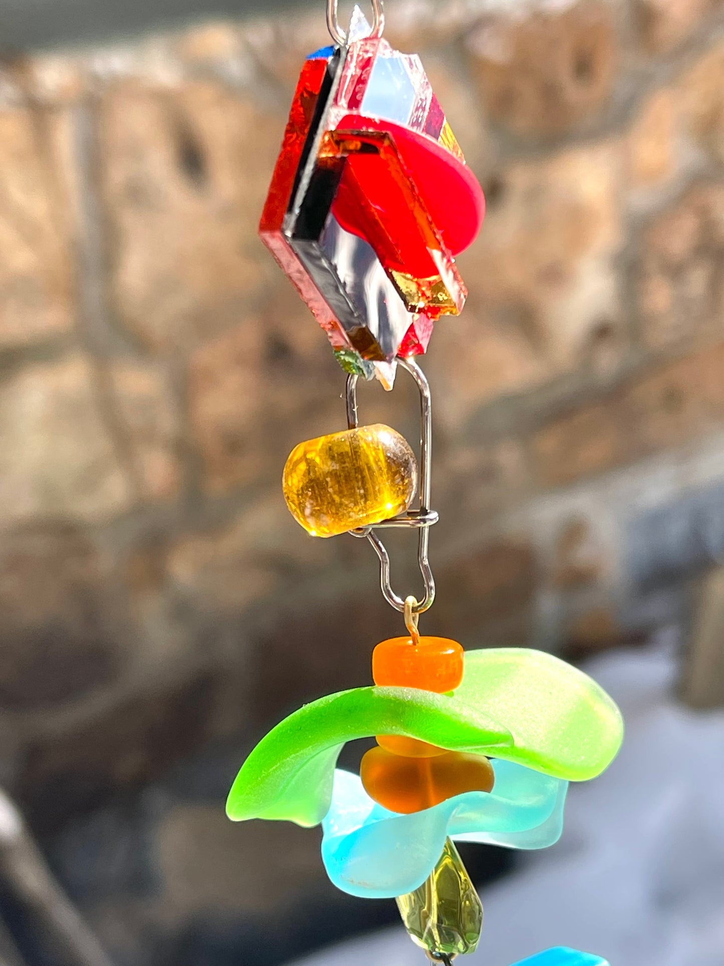 Long 48" mirror mosaic sun chain lots of blue, glowing amber, juicy reds