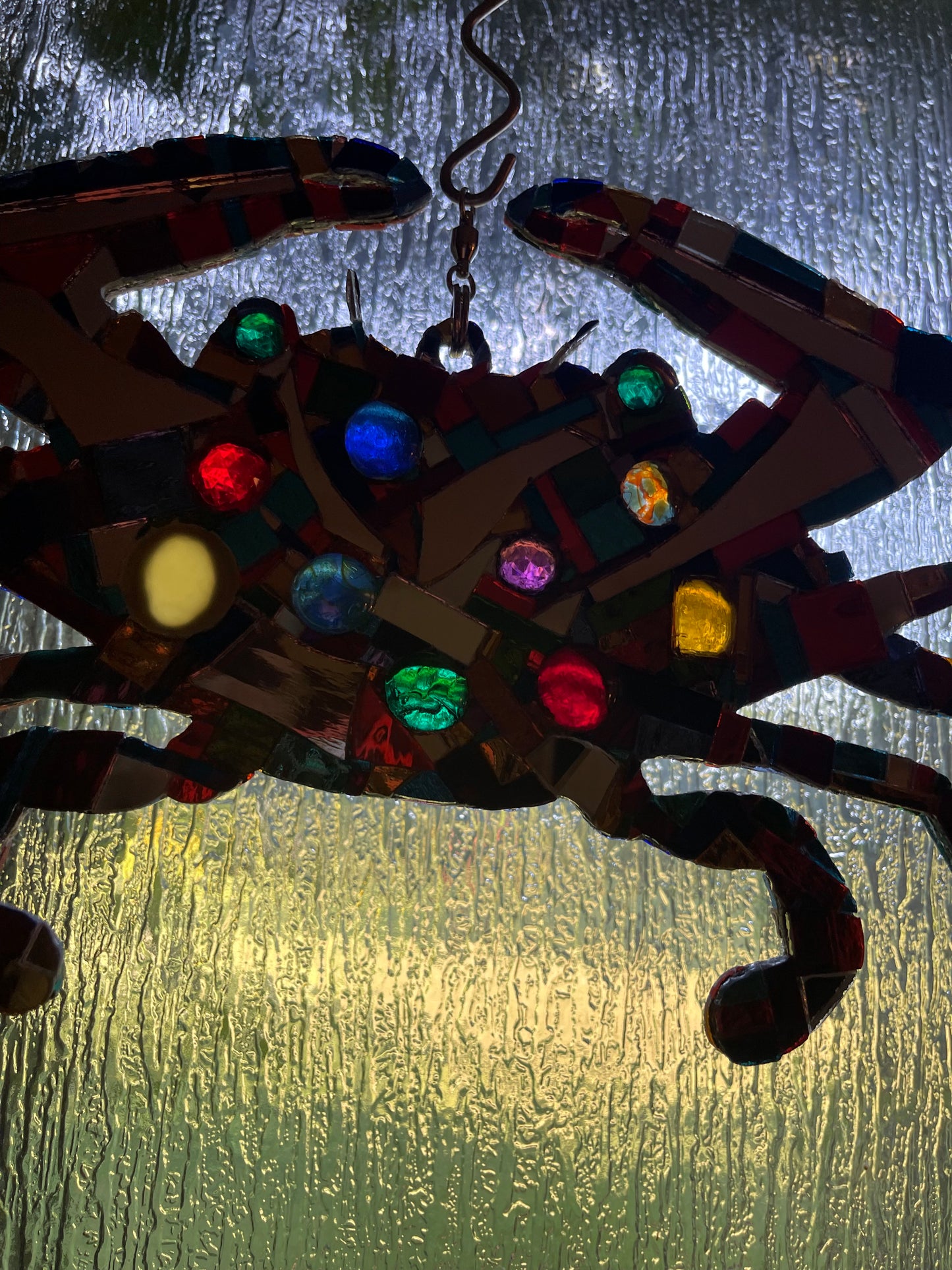 Mirror mosaic-clad steel crab hangs inside or outside on a ball-bearing swivel