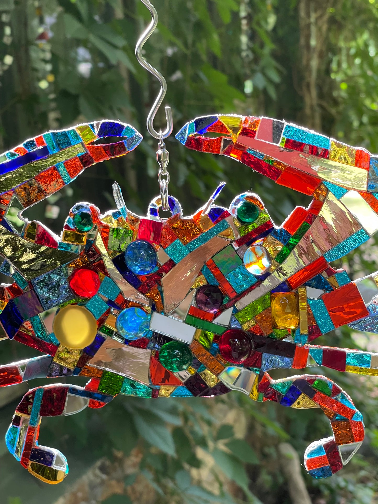 Mirror mosaic-clad steel crab hangs inside or outside on a ball-bearing swivel
