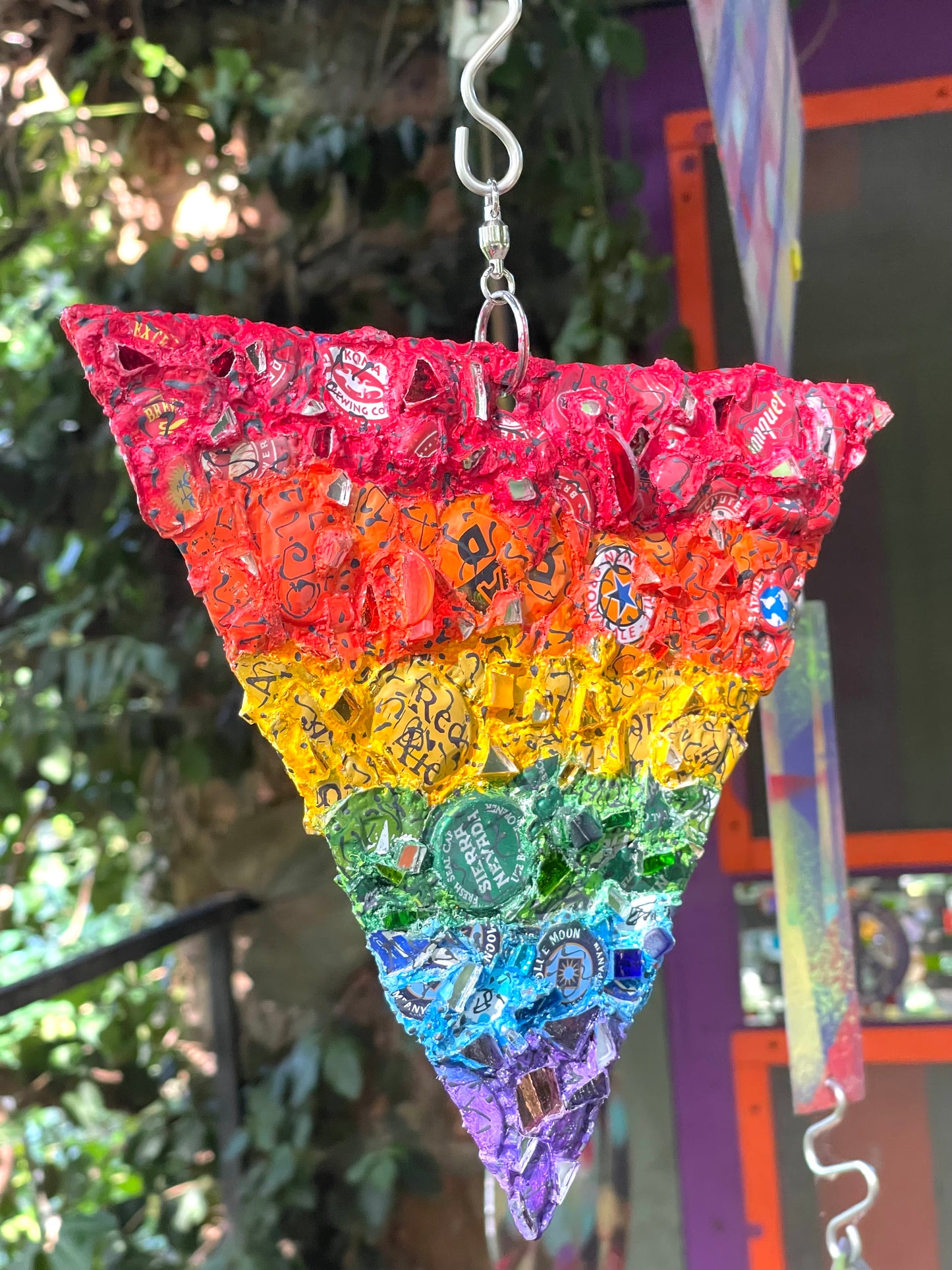 Rainbow pride bottle cap triangle with mirror bits. Glorious!