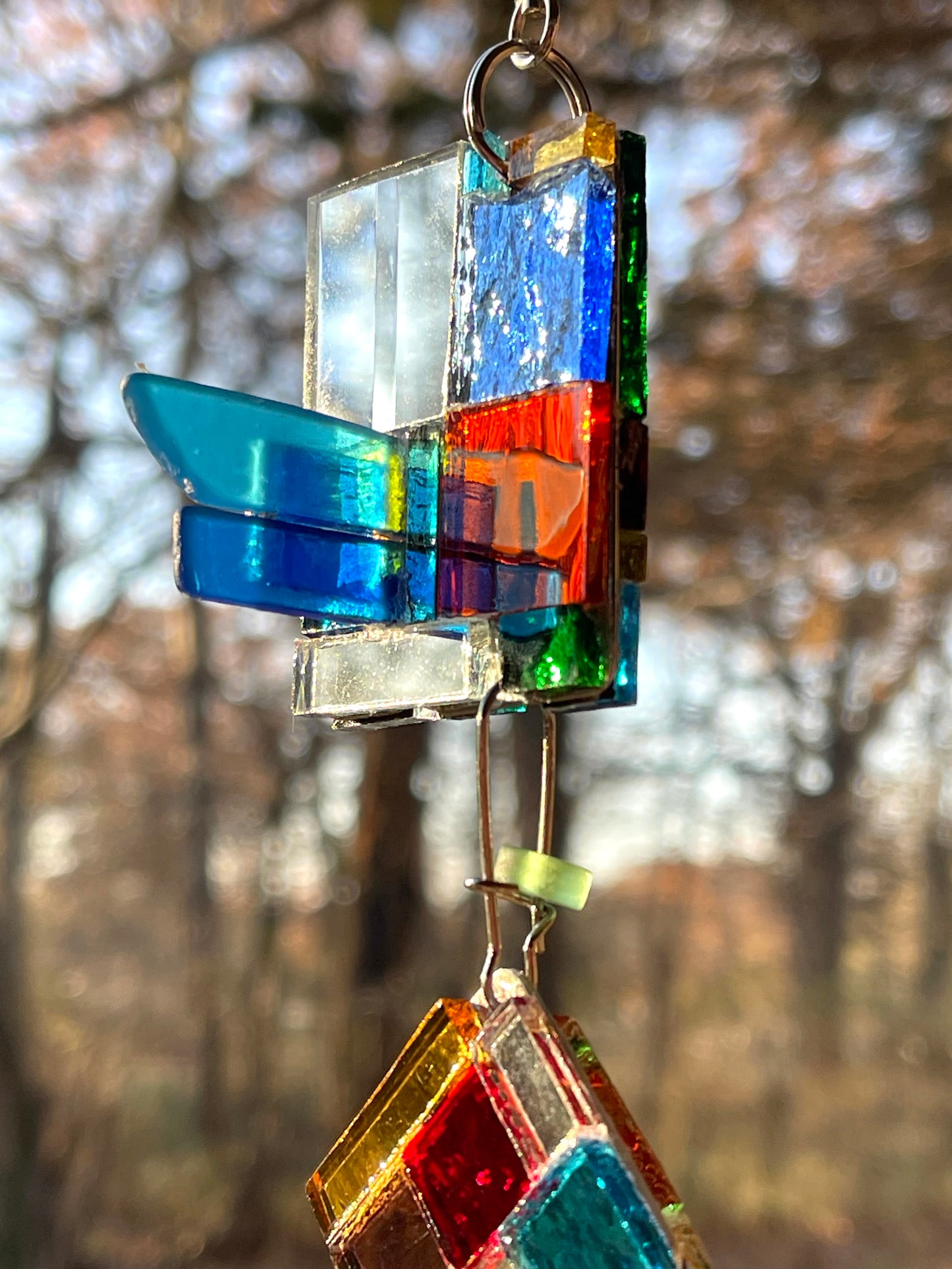 Contemporary 42” long mini mirror mosaic sun chain with colored glass, prism, repurposed bottle throat and glass beads. Dazzling.