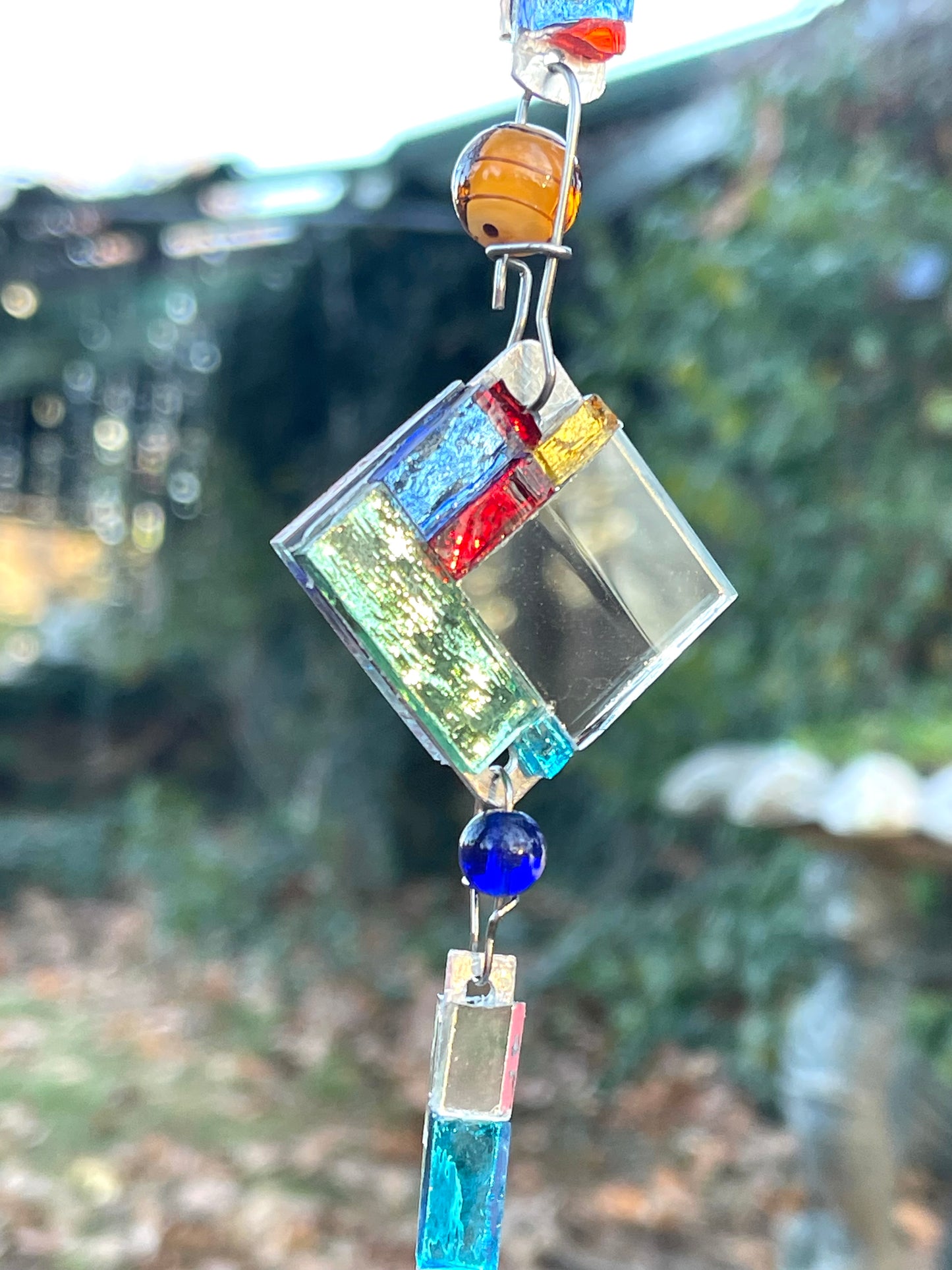 Contemporary 42” long mini mirror mosaic sun chain with colored glass, prism, repurposed bottle throat and glass beads. Dazzling.